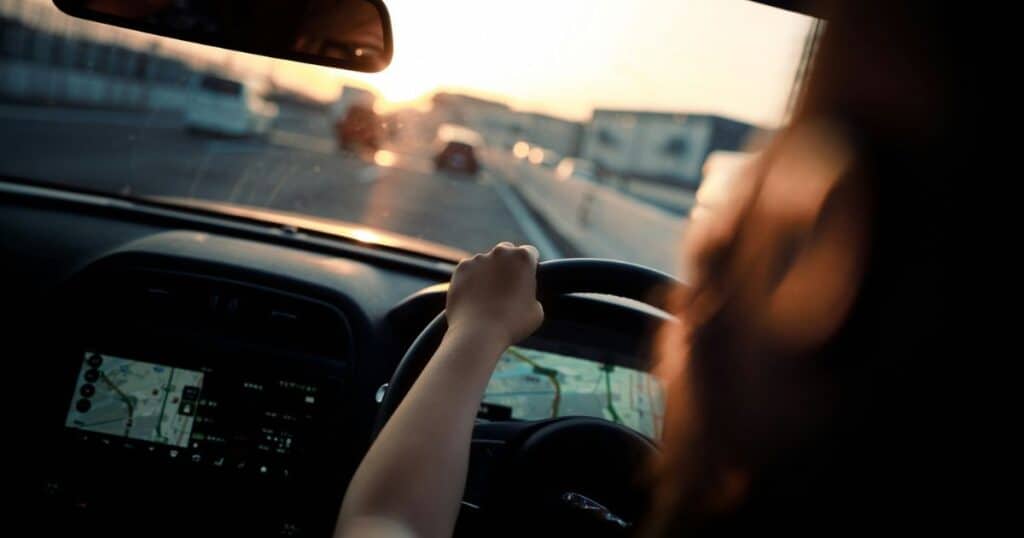 woman driving in early morning