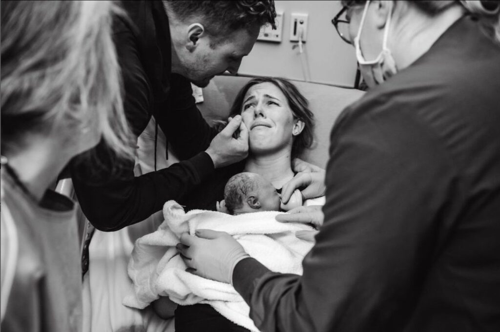 Hospital Birth with newborn on chest. Photo by Photo by Danielle Wilstead of Wild Oak Photography in Salt Lake City.