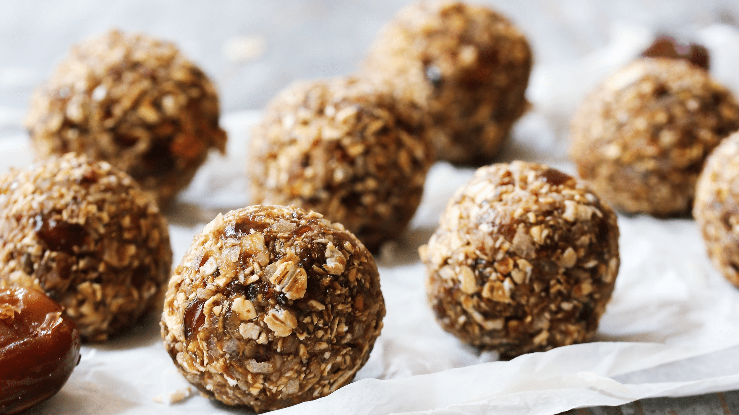 Tray of postpartum energy balls on parchment paper