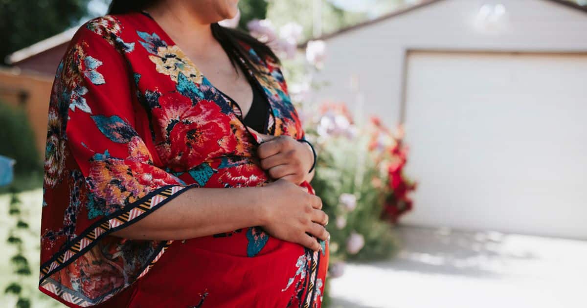 pregnant outside in red robe